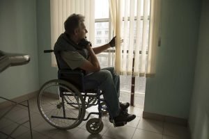 man in wheelchair of nursing home